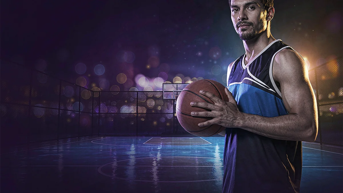 Jolibet basketball player holding a ball on a court